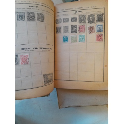 114 - Stamps : a varied collection of mainly used stamps of the world in a variety of albums, schoolboy co... 