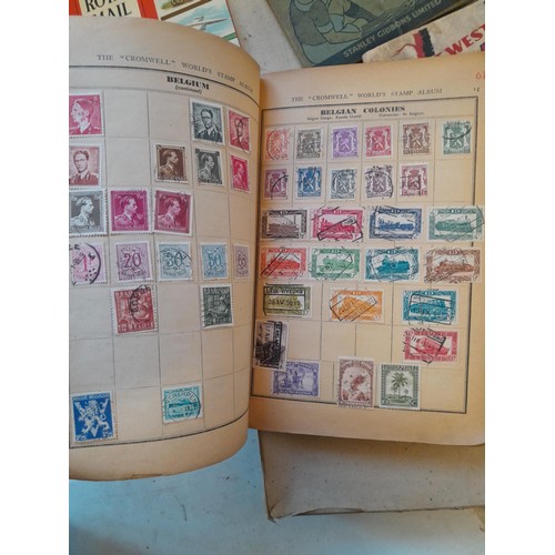 114 - Stamps : a varied collection of mainly used stamps of the world in a variety of albums, schoolboy co... 