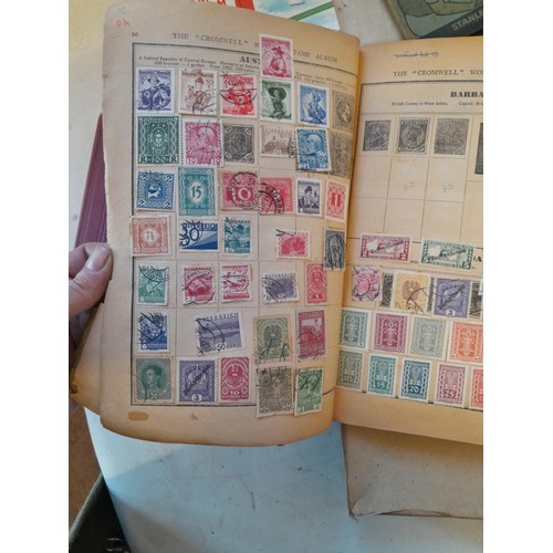 114 - Stamps : a varied collection of mainly used stamps of the world in a variety of albums, schoolboy co... 