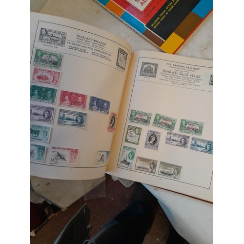 114 - Stamps : a varied collection of mainly used stamps of the world in a variety of albums, schoolboy co... 