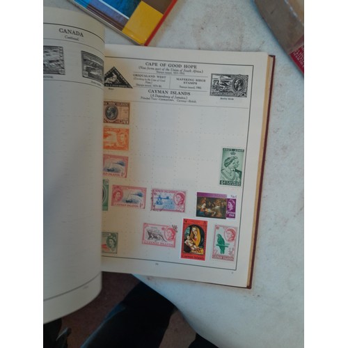 114 - Stamps : a varied collection of mainly used stamps of the world in a variety of albums, schoolboy co... 