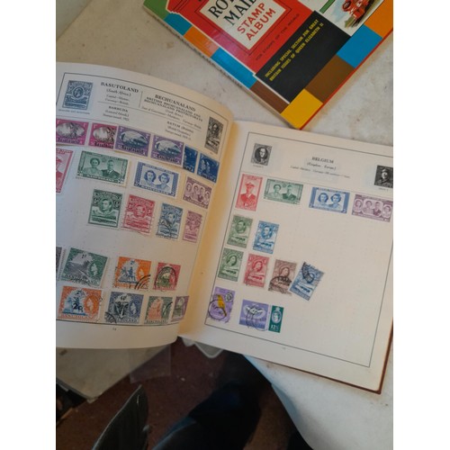 114 - Stamps : a varied collection of mainly used stamps of the world in a variety of albums, schoolboy co... 