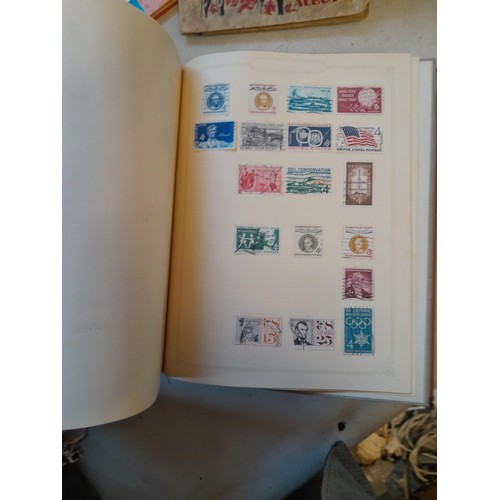 114 - Stamps : a varied collection of mainly used stamps of the world in a variety of albums, schoolboy co... 