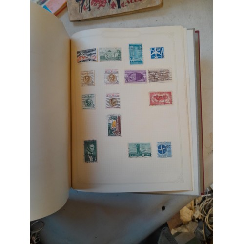 114 - Stamps : a varied collection of mainly used stamps of the world in a variety of albums, schoolboy co... 