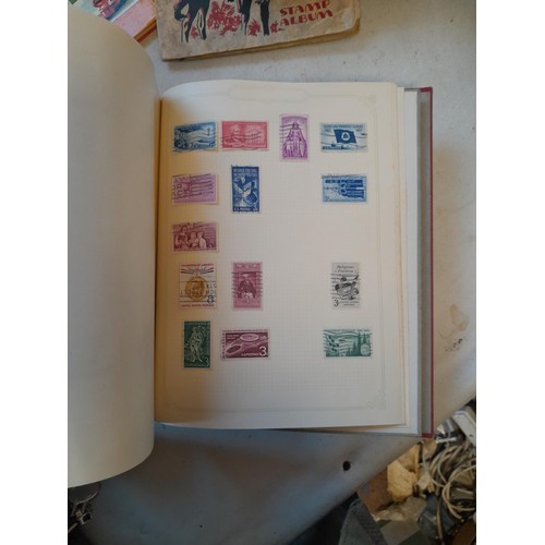 114 - Stamps : a varied collection of mainly used stamps of the world in a variety of albums, schoolboy co... 