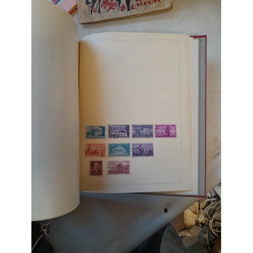 114 - Stamps : a varied collection of mainly used stamps of the world in a variety of albums, schoolboy co... 