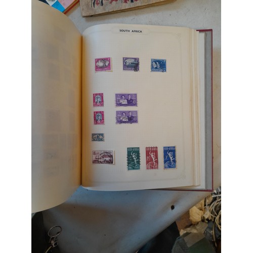 114 - Stamps : a varied collection of mainly used stamps of the world in a variety of albums, schoolboy co... 