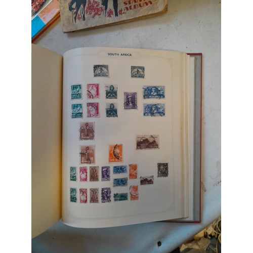 114 - Stamps : a varied collection of mainly used stamps of the world in a variety of albums, schoolboy co... 