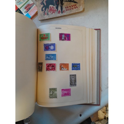 114 - Stamps : a varied collection of mainly used stamps of the world in a variety of albums, schoolboy co... 