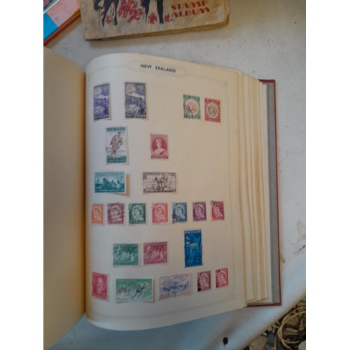 114 - Stamps : a varied collection of mainly used stamps of the world in a variety of albums, schoolboy co... 