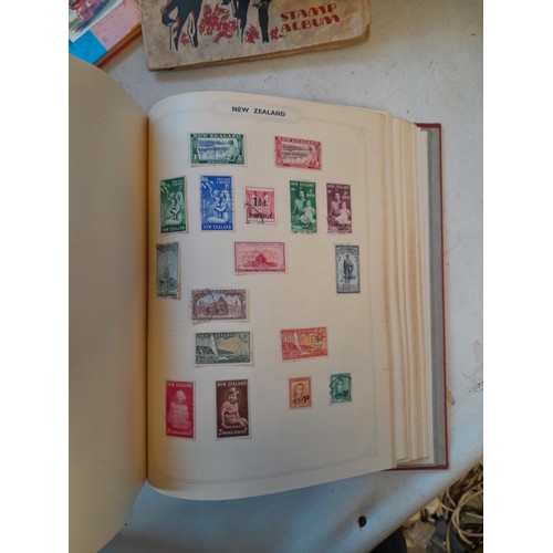 114 - Stamps : a varied collection of mainly used stamps of the world in a variety of albums, schoolboy co... 