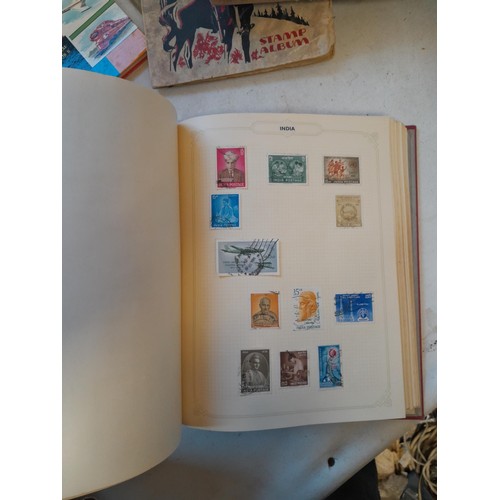 114 - Stamps : a varied collection of mainly used stamps of the world in a variety of albums, schoolboy co... 