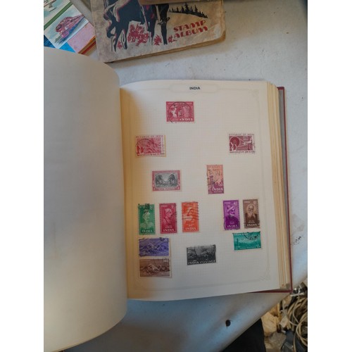 114 - Stamps : a varied collection of mainly used stamps of the world in a variety of albums, schoolboy co... 