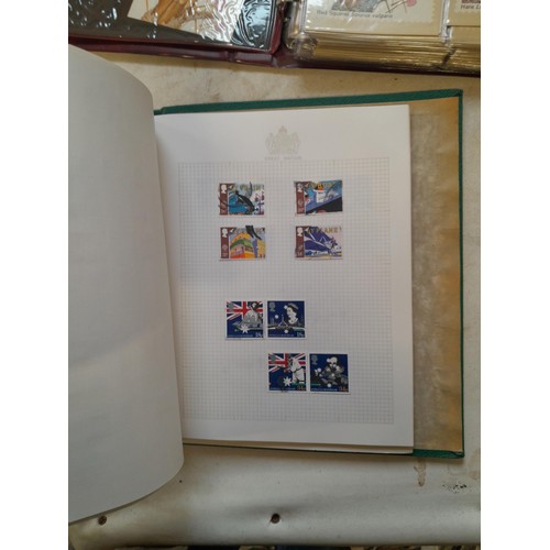 157 - Stamps of GB mainly used in five albums and three stock books with a folder of PHQ cards approx 11 k... 