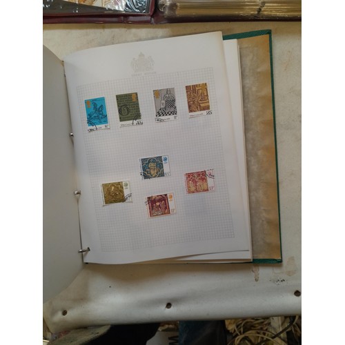 157 - Stamps of GB mainly used in five albums and three stock books with a folder of PHQ cards approx 11 k... 