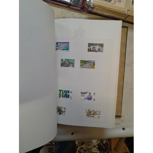 157 - Stamps of GB mainly used in five albums and three stock books with a folder of PHQ cards approx 11 k... 