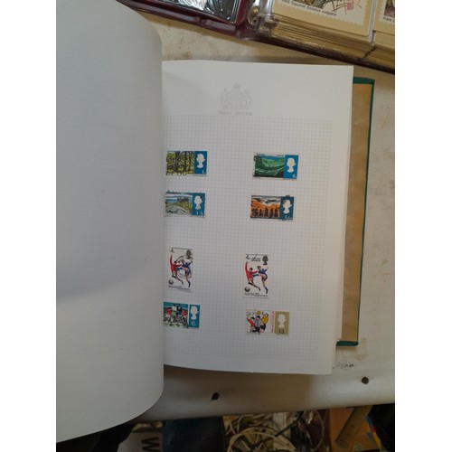 157 - Stamps of GB mainly used in five albums and three stock books with a folder of PHQ cards approx 11 k... 