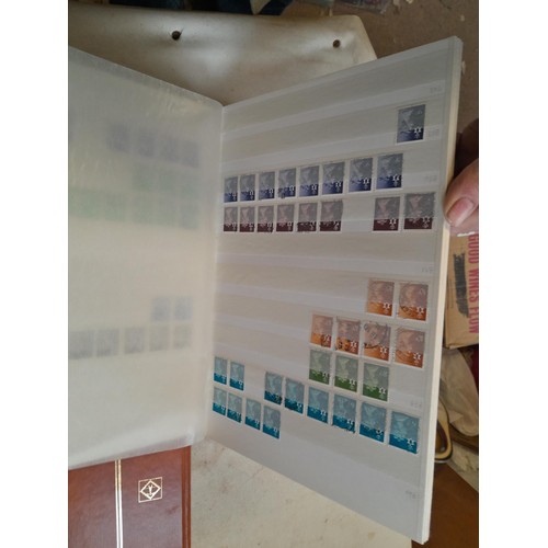 157 - Stamps of GB mainly used in five albums and three stock books with a folder of PHQ cards approx 11 k... 