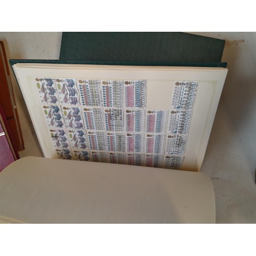 157 - Stamps of GB mainly used in five albums and three stock books with a folder of PHQ cards approx 11 k... 