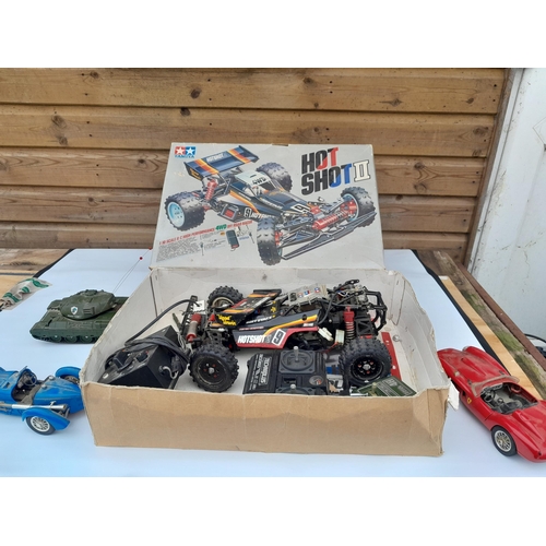 141 - Tamiya radio controlled car, 2 x Burago die cast cars and Radio Racer Mighty Tank