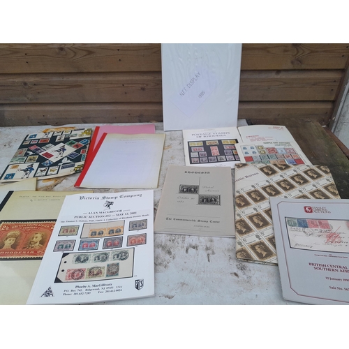 41 - Box of Stamps on paper, and a box of philatelic reference material, mainly on Africa including South... 