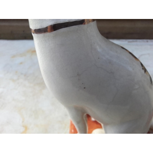 14 - Interesting pair of 19th century Staffordshire pottery cats, note dirty crazing