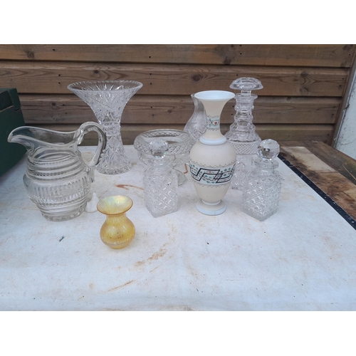 100 - Glassware : cut glass vases and decanters and iridescent vase