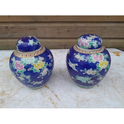 110 - Pair of 19th century Famille Rose Chinese vases with bird decoration with covers