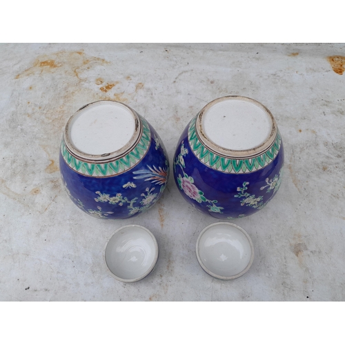 110 - Pair of 19th century Famille Rose Chinese vases with bird decoration with covers