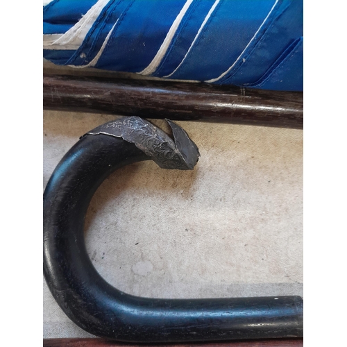 147 - Collection of mixed era walking sticks, canes and umbrellas : silver collars included