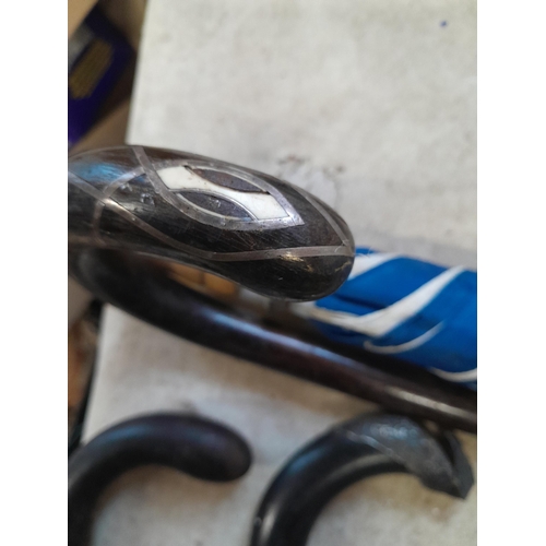 147 - Collection of mixed era walking sticks, canes and umbrellas : silver collars included