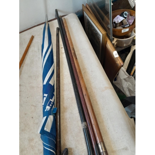 147 - Collection of mixed era walking sticks, canes and umbrellas : silver collars included