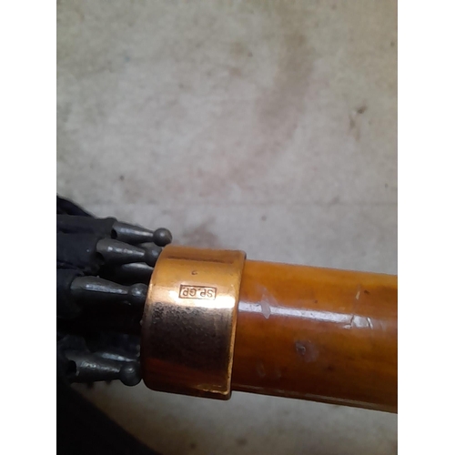 148 - Mixed era umbrellas with rolled gold or gold plated collars