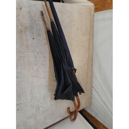 148 - Mixed era umbrellas with rolled gold or gold plated collars