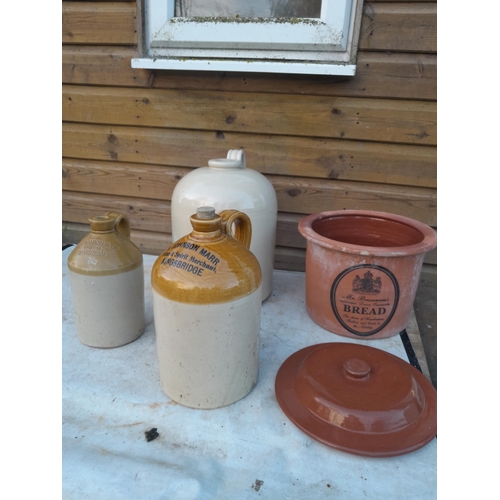 14 - Advertising and non advertising stoneware flagons, bread bin, chip on rim