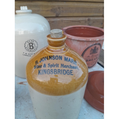 14 - Advertising and non advertising stoneware flagons, bread bin, chip on rim