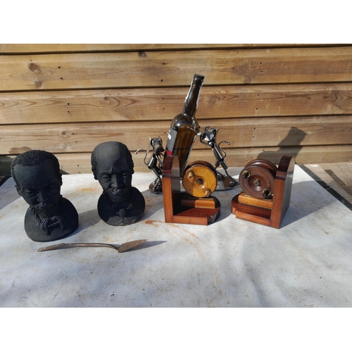 38 - Vintage fishing reel bookends, pair of African pottery busts and bottle holder