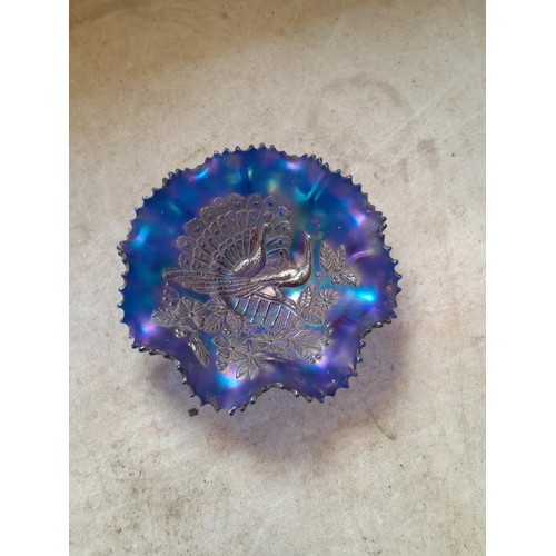 42 - Iridescent cobalt blue probably Northwood carnival glass dish decorated with Peacocks on a fence