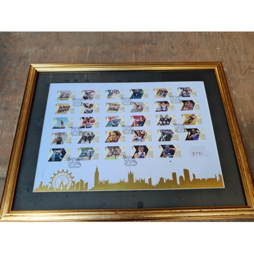55 - Ltd Edition Olympic stamps mint sheet behind glass