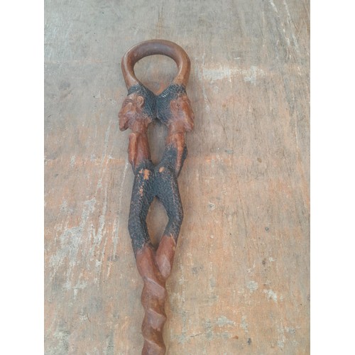 48 - Box of oddments : tin sign modern, resin ornament, car related manuals, prints, African walking stic... 