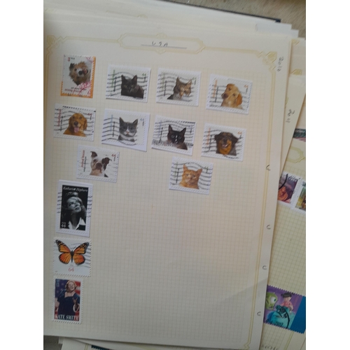 134 - Stamps of USA in three folders 1000 plus stamps mint unused and used, only a small sample photograph... 