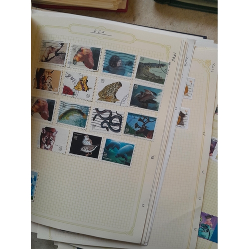 134 - Stamps of USA in three folders 1000 plus stamps mint unused and used, only a small sample photograph... 