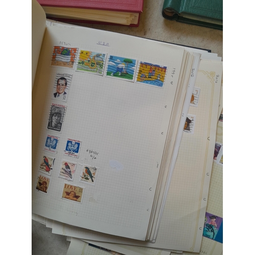 134 - Stamps of USA in three folders 1000 plus stamps mint unused and used, only a small sample photograph... 