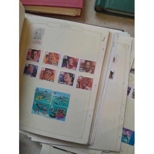 134 - Stamps of USA in three folders 1000 plus stamps mint unused and used, only a small sample photograph... 