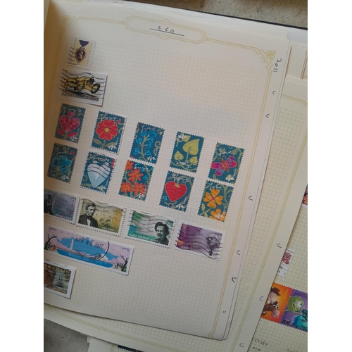 134 - Stamps of USA in three folders 1000 plus stamps mint unused and used, only a small sample photograph... 