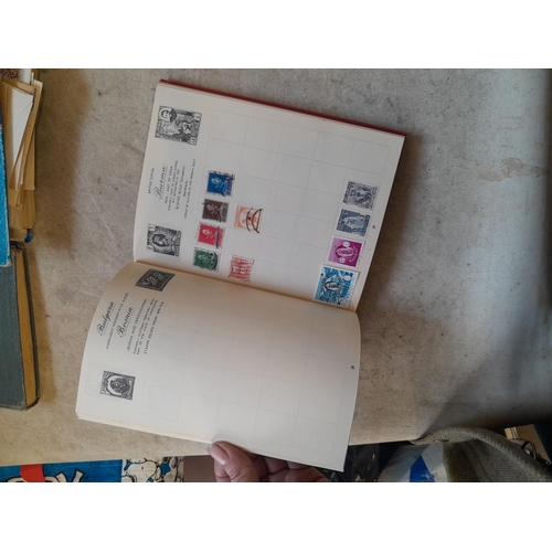 136 - Stamps: a box of stamps albums, ice cream carton of stamps on paper and loose, mixed era world stamp... 