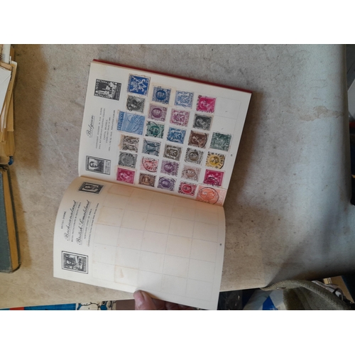 136 - Stamps: a box of stamps albums, ice cream carton of stamps on paper and loose, mixed era world stamp... 