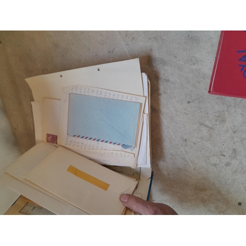 136 - Stamps: a box of stamps albums, ice cream carton of stamps on paper and loose, mixed era world stamp... 