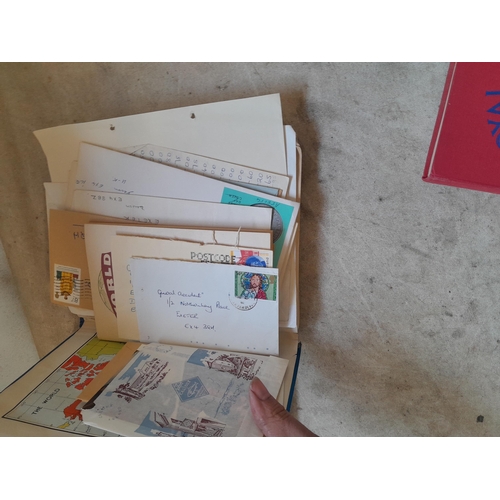 136 - Stamps: a box of stamps albums, ice cream carton of stamps on paper and loose, mixed era world stamp... 