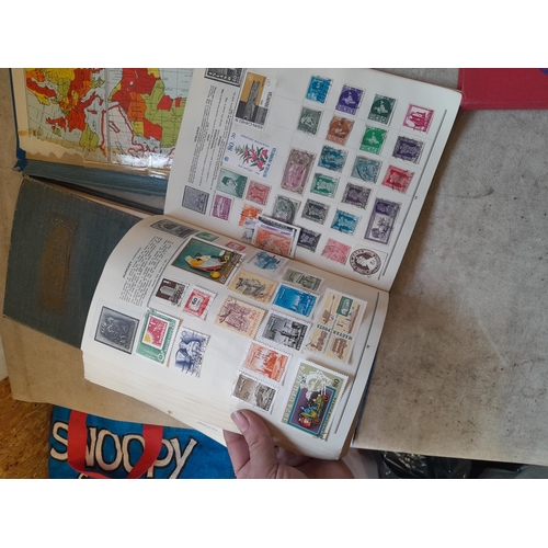 136 - Stamps: a box of stamps albums, ice cream carton of stamps on paper and loose, mixed era world stamp... 